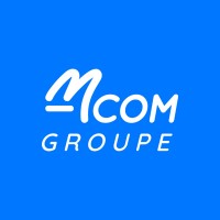 M COM logo