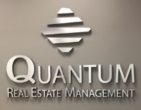 Quantum Real Estate Management logo